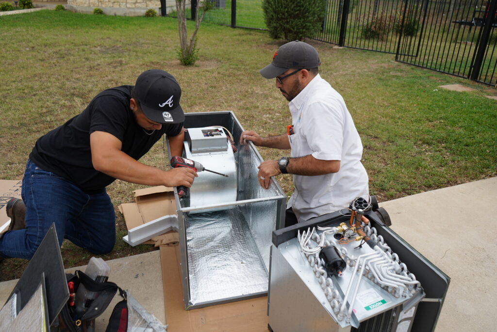 Dilmak Services crew assembling ductwork on site in San Antonio