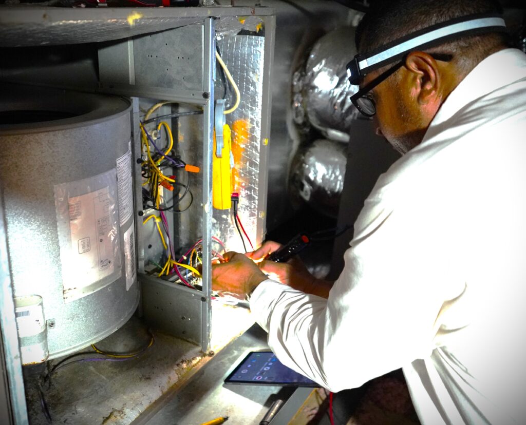 Dilmak technician testing a furnace during a heating repair